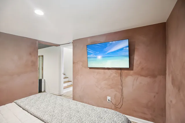 a view of a city with lush green forest