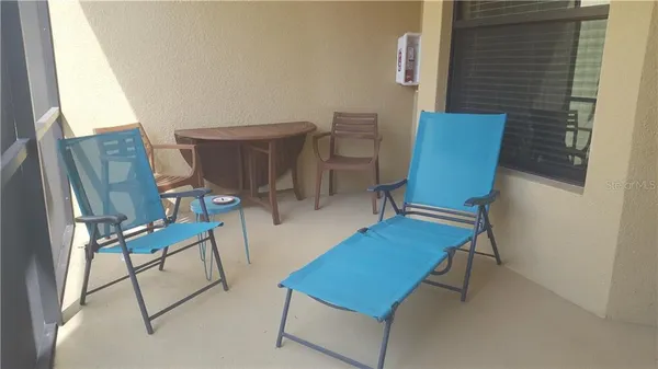 a view of a room with furniture and wooden floor