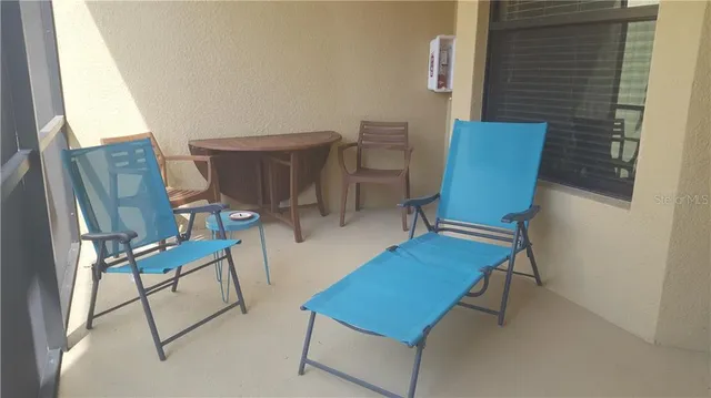 a view of a room with furniture and wooden floor