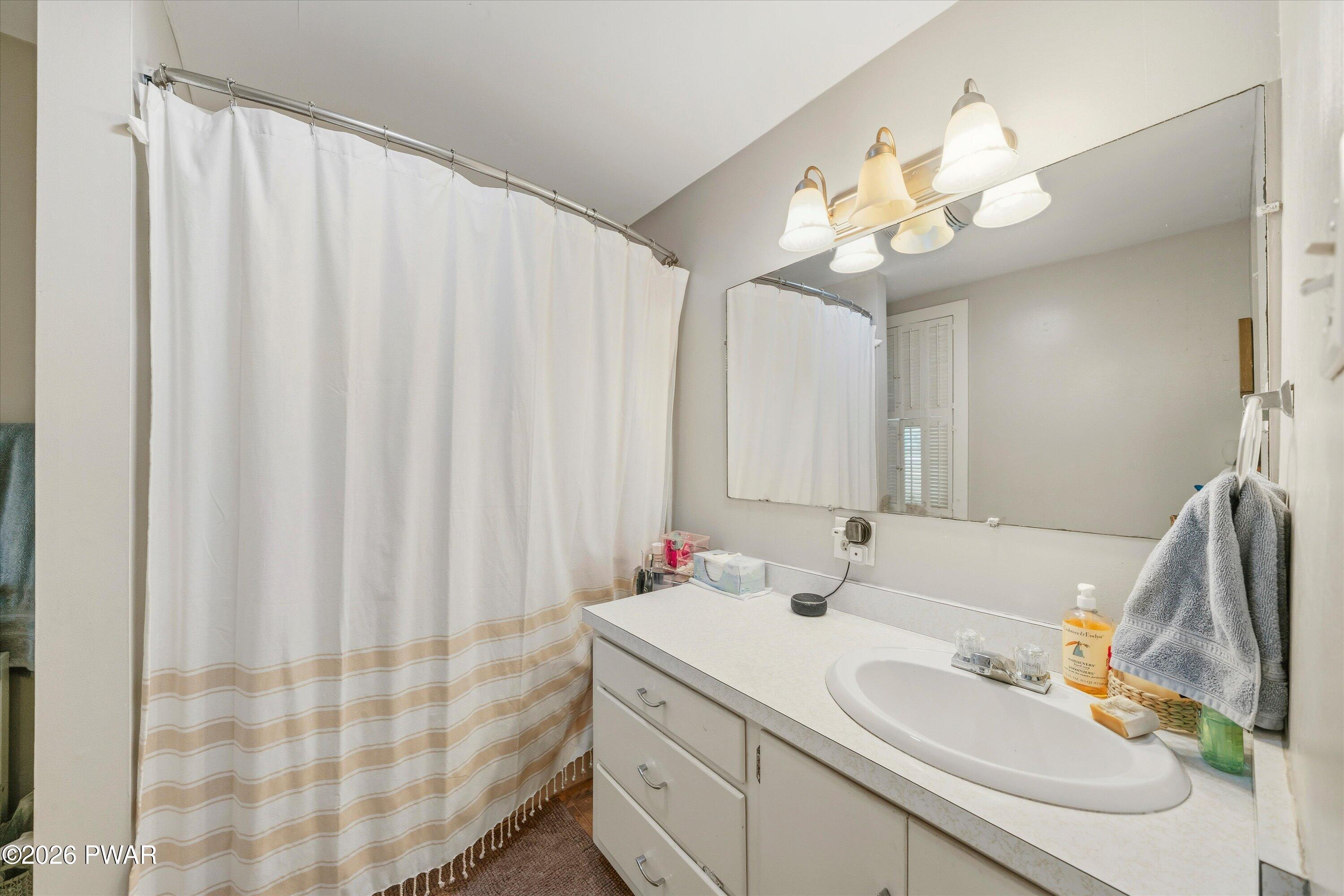 127 Valleyview Road Greentown, PA 18426 - Photo 37 of 66 a bathroom with a sink vanity and a mirror