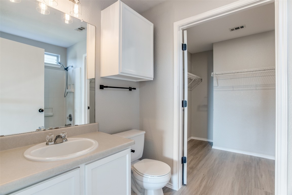 13145 Briarcreek Loop Manor, TX 78653 - Photo 18 of 25 a bathroom with a sink toilet and shower