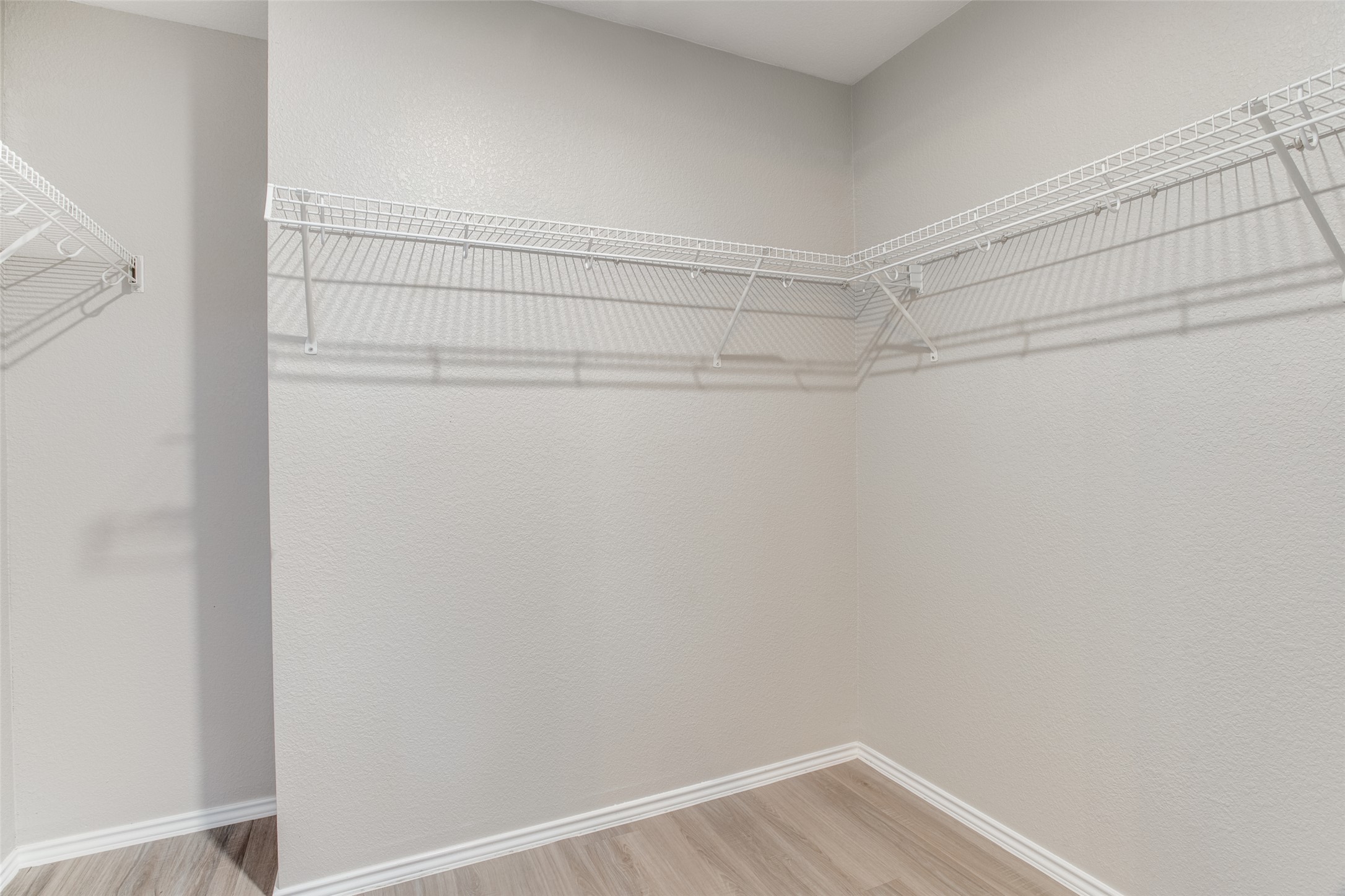 13145 Briarcreek Loop Manor, TX 78653 - Photo 19 of 25 a view of a room with racks on the wall