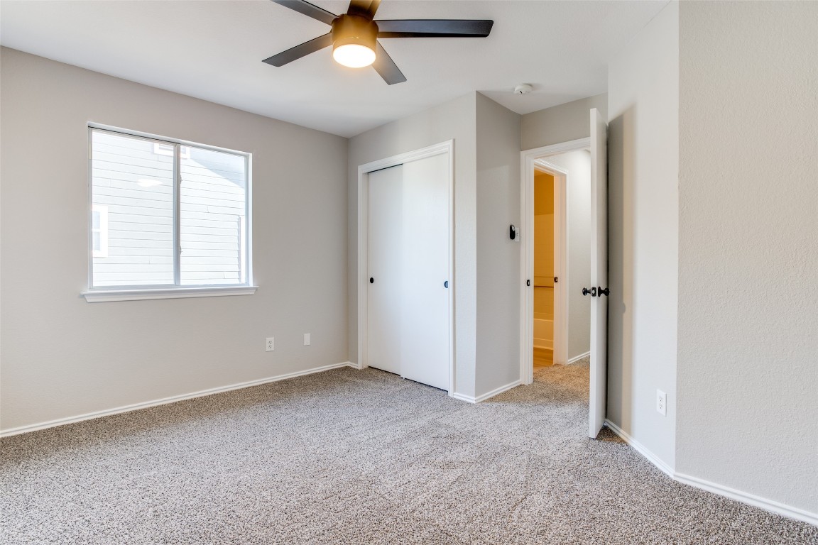 13145 Briarcreek Loop Manor, TX 78653 - Photo 21 of 25 a view of an empty room with a window