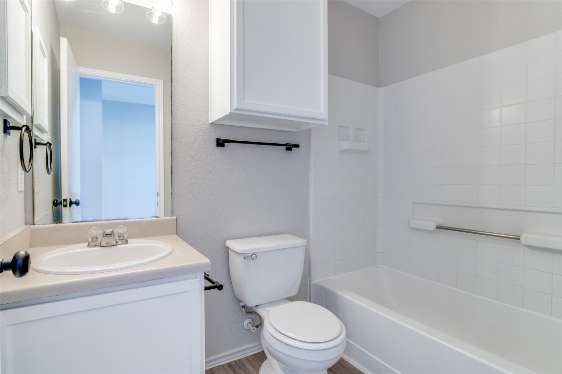 13145 Briarcreek Loop Manor, TX 78653 - Photo 22 of 25 a bathroom with a sink toilet and bathtub