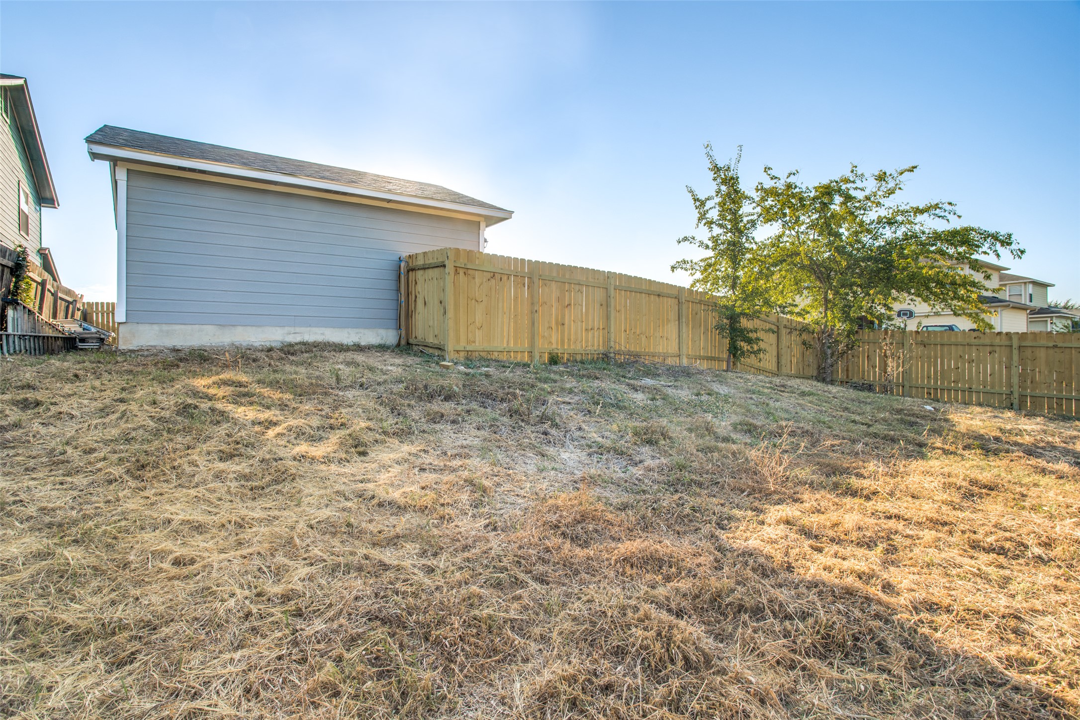 13145 Briarcreek Loop Manor, TX 78653 - Photo 24 of 25 a view of a backyard