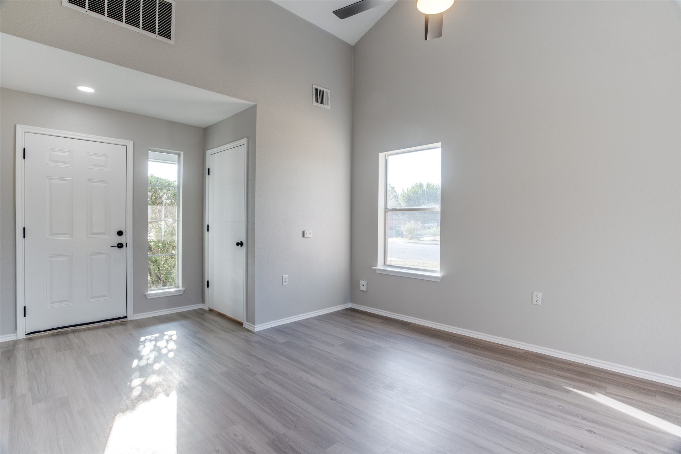 13145 Briarcreek Loop Manor, TX 78653 - Photo 4 of 25 wooden floor in an empty room with a window