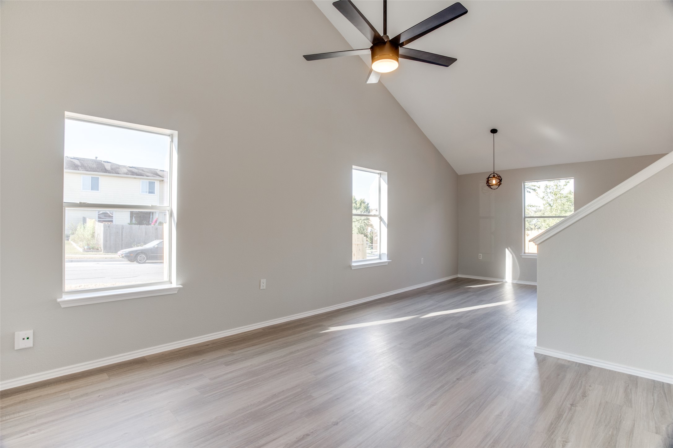 13145 Briarcreek Loop Manor, TX 78653 - Photo 6 of 25 a view of an empty room with a window and wooden floor