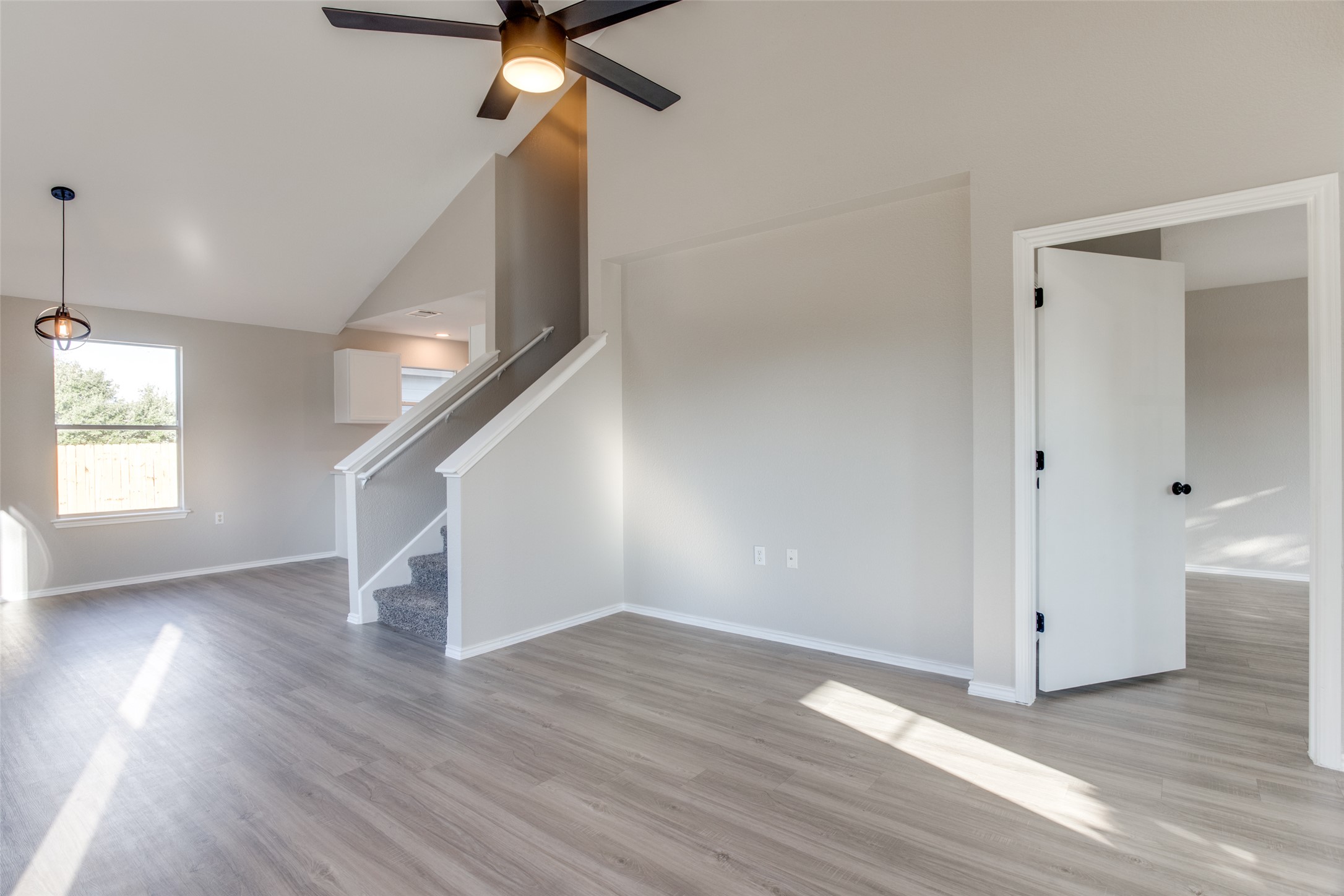 13145 Briarcreek Loop Manor, TX 78653 - Photo 7 of 25 wooden floor in an empty room with a window