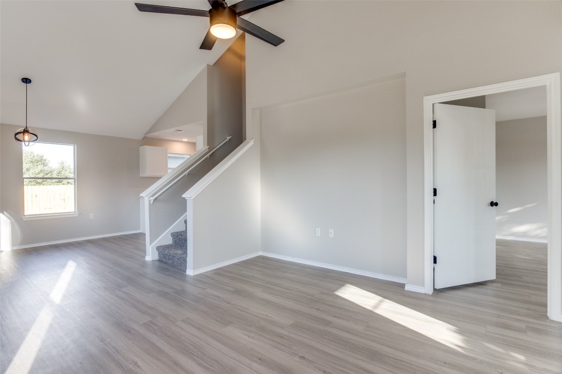 13145 Briarcreek Loop Manor, TX 78653 - Photo 7 of 25 wooden floor in an empty room with a window
