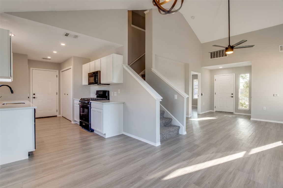 13145 Briarcreek Loop Manor, TX 78653 - Photo 10 of 25 a view of kitchen with microwave and refrigerator