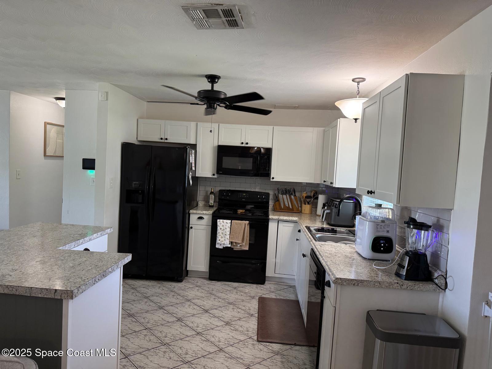 2394 Shenandoah Road Palm Bay, FL 32905 - Photo 14 of 23 Kitchen