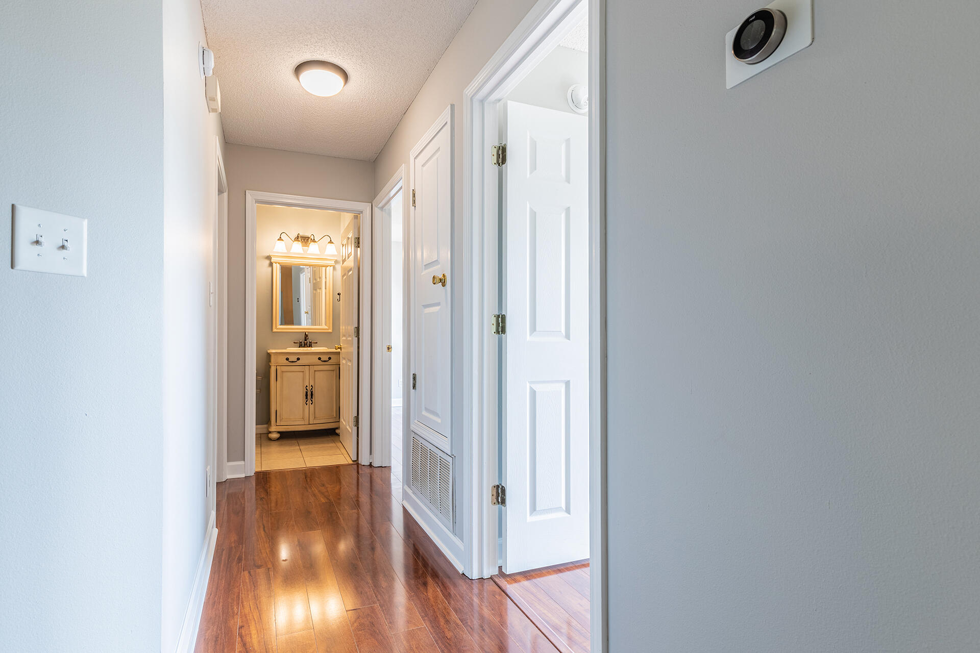 2500 Cameron Way Navarre, FL 32566 - Photo 14 of 32 a view of a hallway with wooden floor