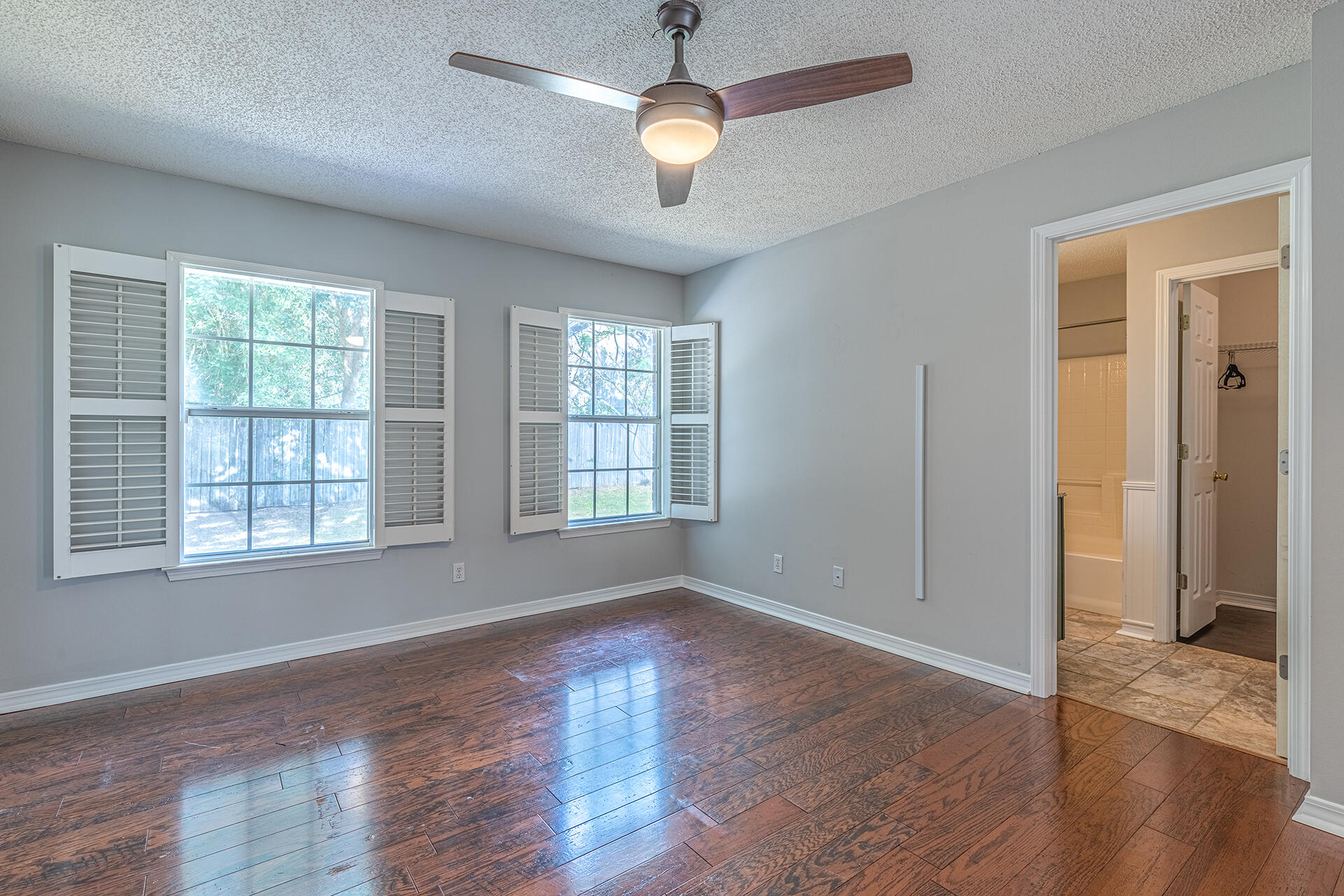 2500 Cameron Way Navarre, FL 32566 - Photo 16 of 32 wooden floor in an empty room with a window