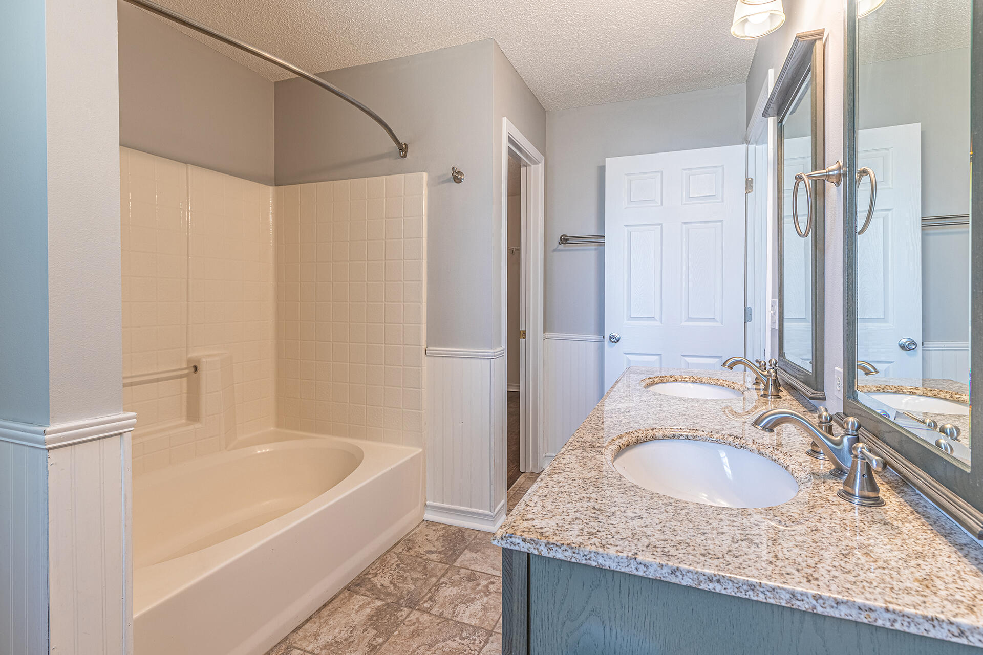2500 Cameron Way Navarre, FL 32566 - Photo 19 of 32 a bathroom with a granite countertop tub sink and mirror