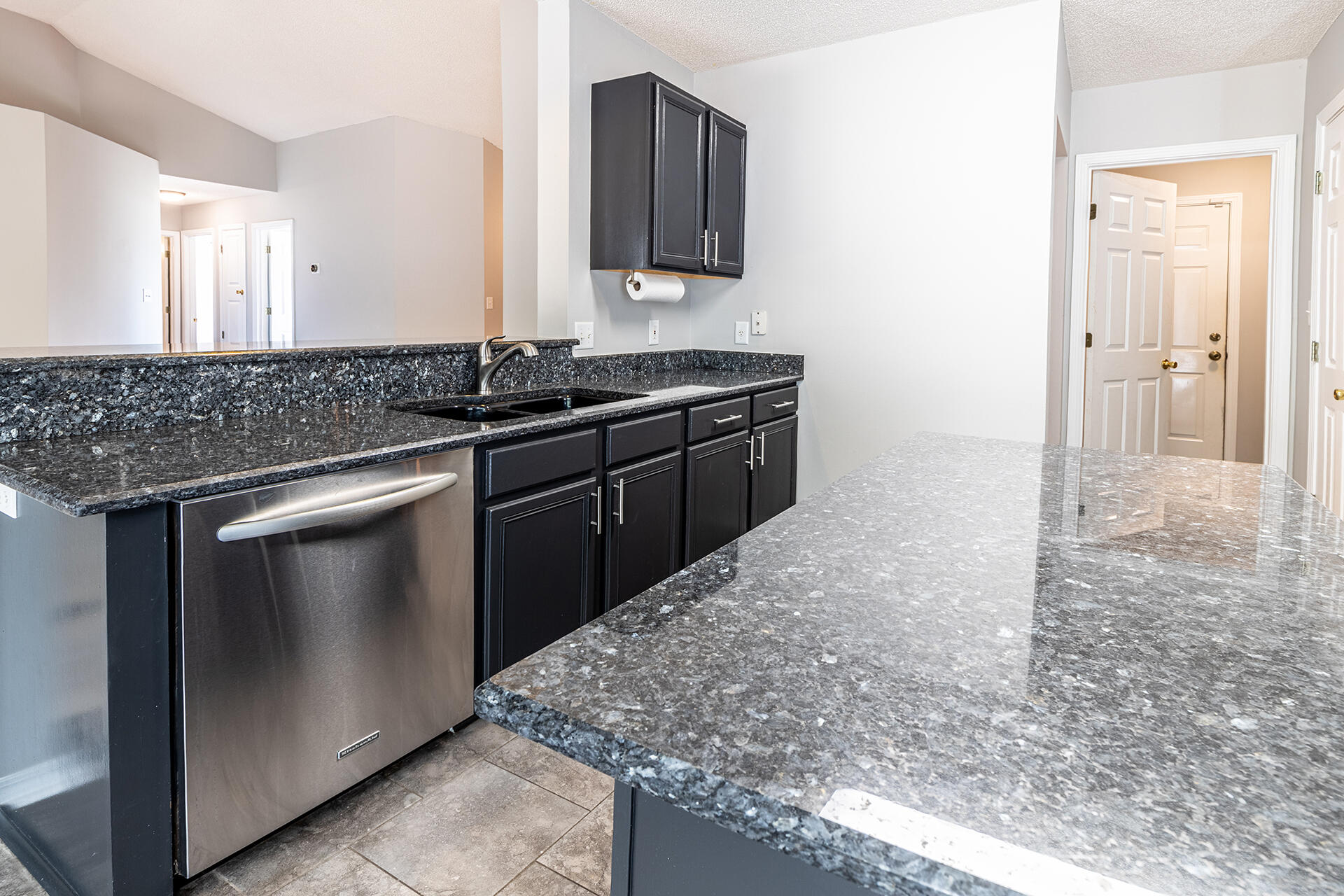 2500 Cameron Way Navarre, FL 32566 - Photo 5 of 32 a kitchen with stainless steel appliances granite countertop a sink and a stove