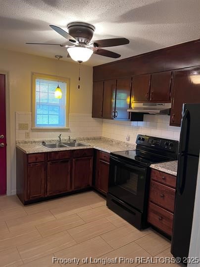 816 Shaw Mill Road Fayetteville, NC 28311 - Photo 4 of 13 a kitchen with stainless steel appliances granite countertop a stove a sink and a microwave
