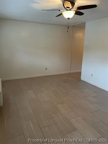 a view of a livingroom with a chandelier fan