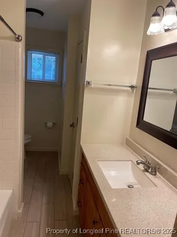 a bathroom with a bath tub