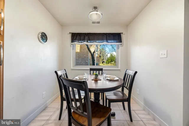 a view of a dining room with furniture wooden floor and chandelier