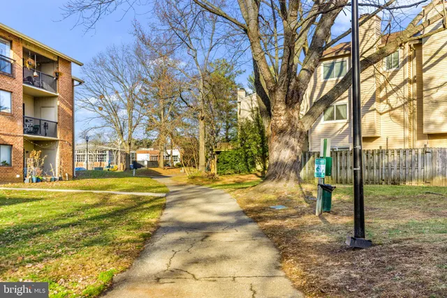 a view of a apartment with a yard