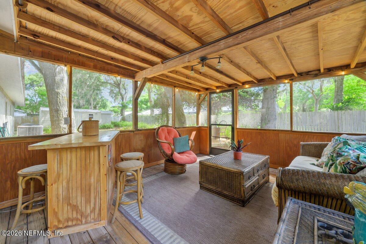 409 Lobelia Road St. Augustine, FL 32086 - Photo 4 of 43 409 Lobelia Rd screen porch and bar\