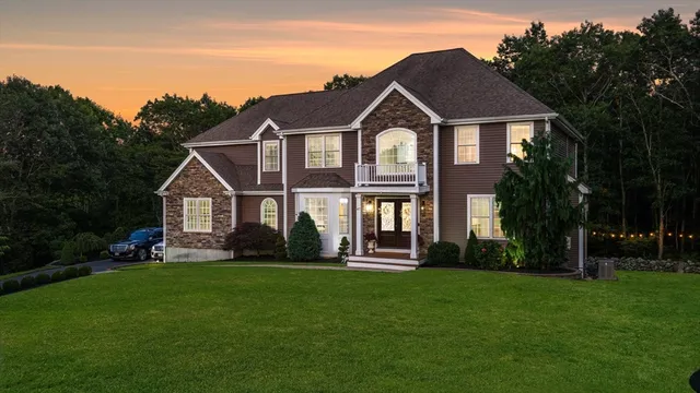 a front view of a house with a yard