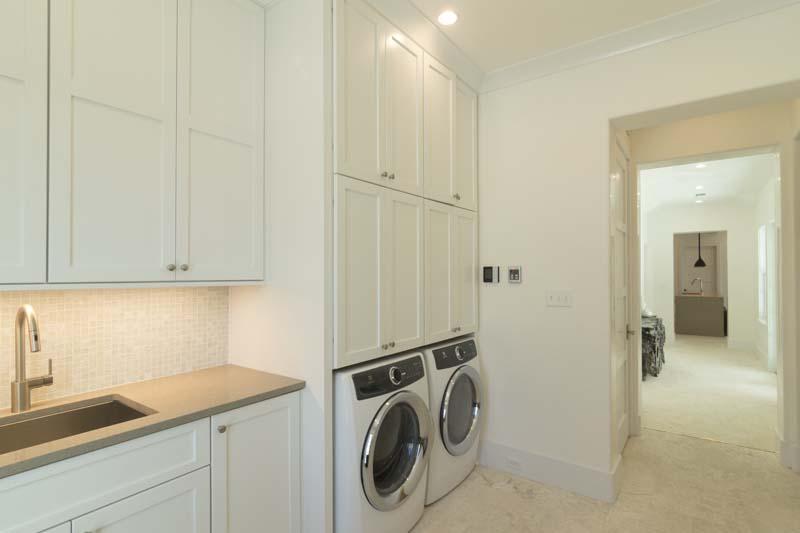 89 North Charles Street Inlet Beach, FL 32461 - Photo 23 of 36 a utility room with sink dryer and washer