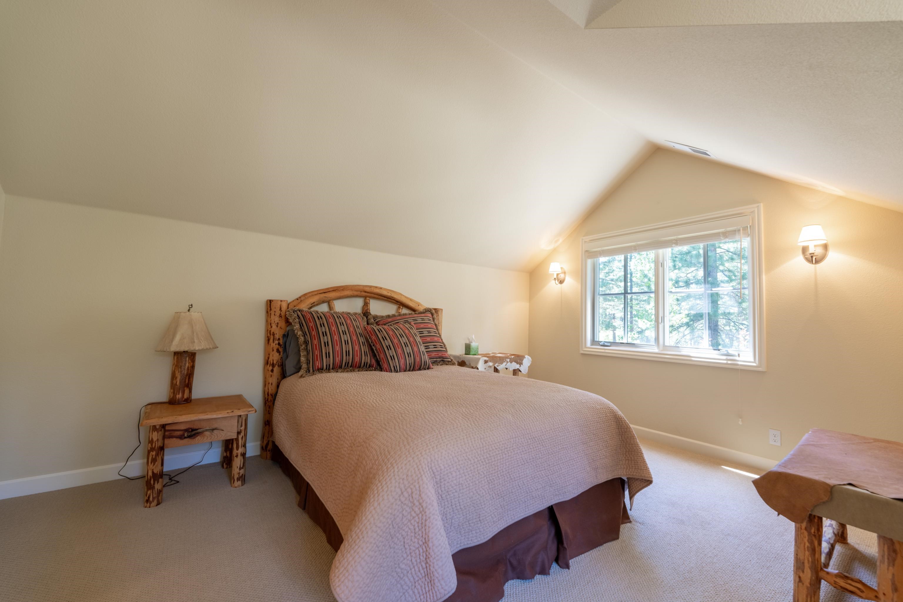 40 Hawk Ridge Clio, CA 96106 - Photo 26 of 42 a bedroom with a bed chair and window