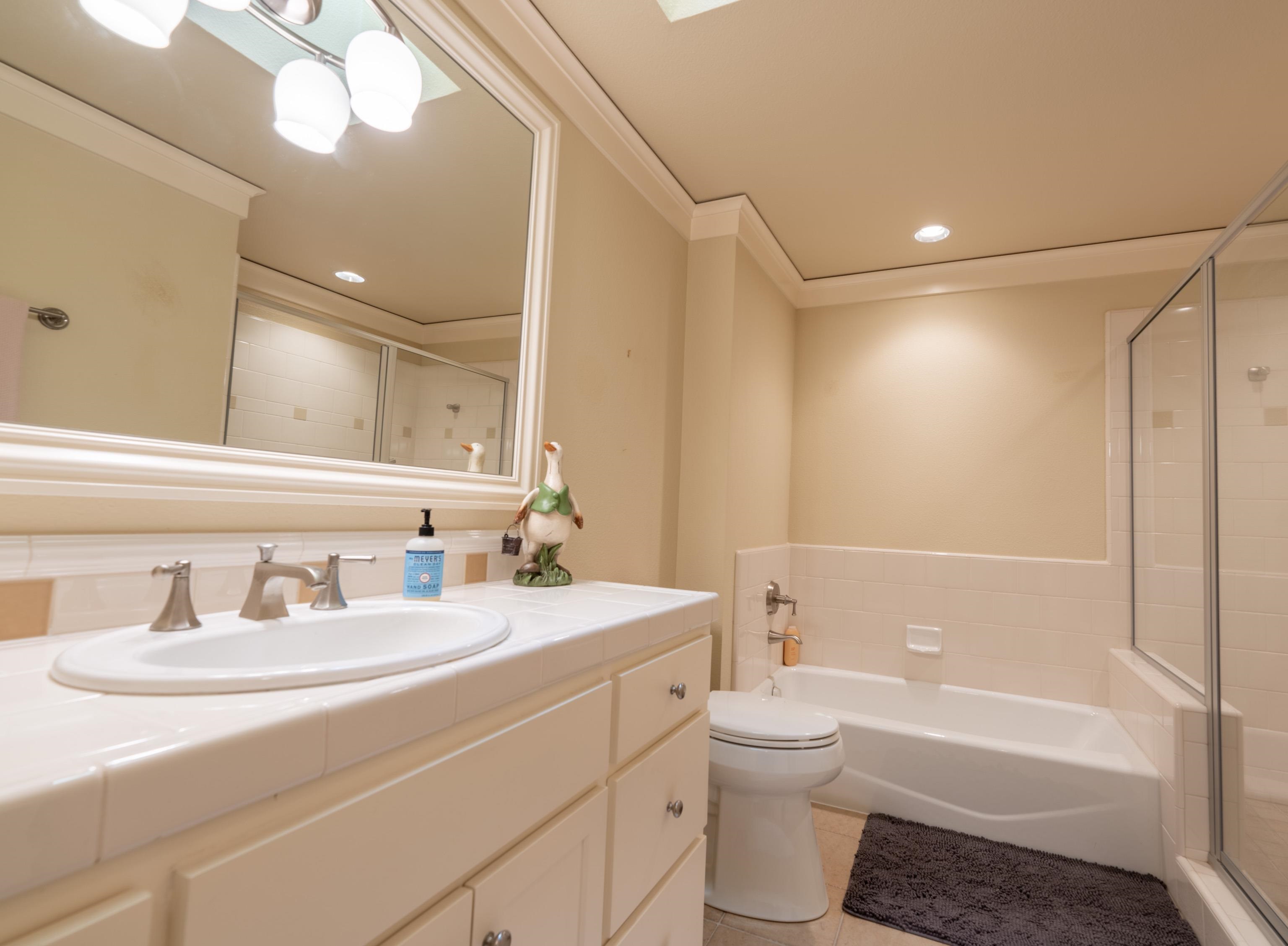 40 Hawk Ridge Clio, CA 96106 - Photo 27 of 42 a bathroom with a double vanity sink toilet mirror and bathtub