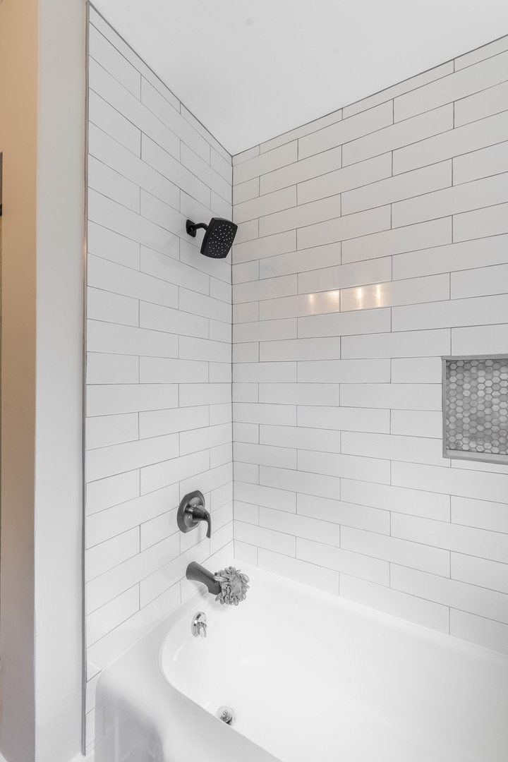 2335 14th Avenue North Riverside, IL 60546 - Photo 14 of 33 a bathroom with a shower and a bathtub