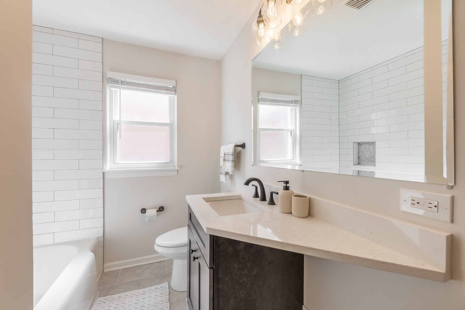 2335 14th Avenue North Riverside, IL 60546 - Photo 15 of 33 a bathroom with a sink a toilet and a window