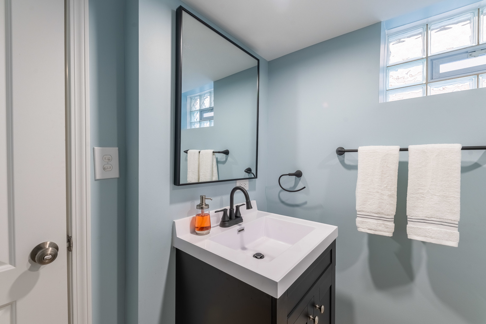 2335 14th Avenue North Riverside, IL 60546 - Photo 17 of 33 a bathroom with a sink a mirror and a window
