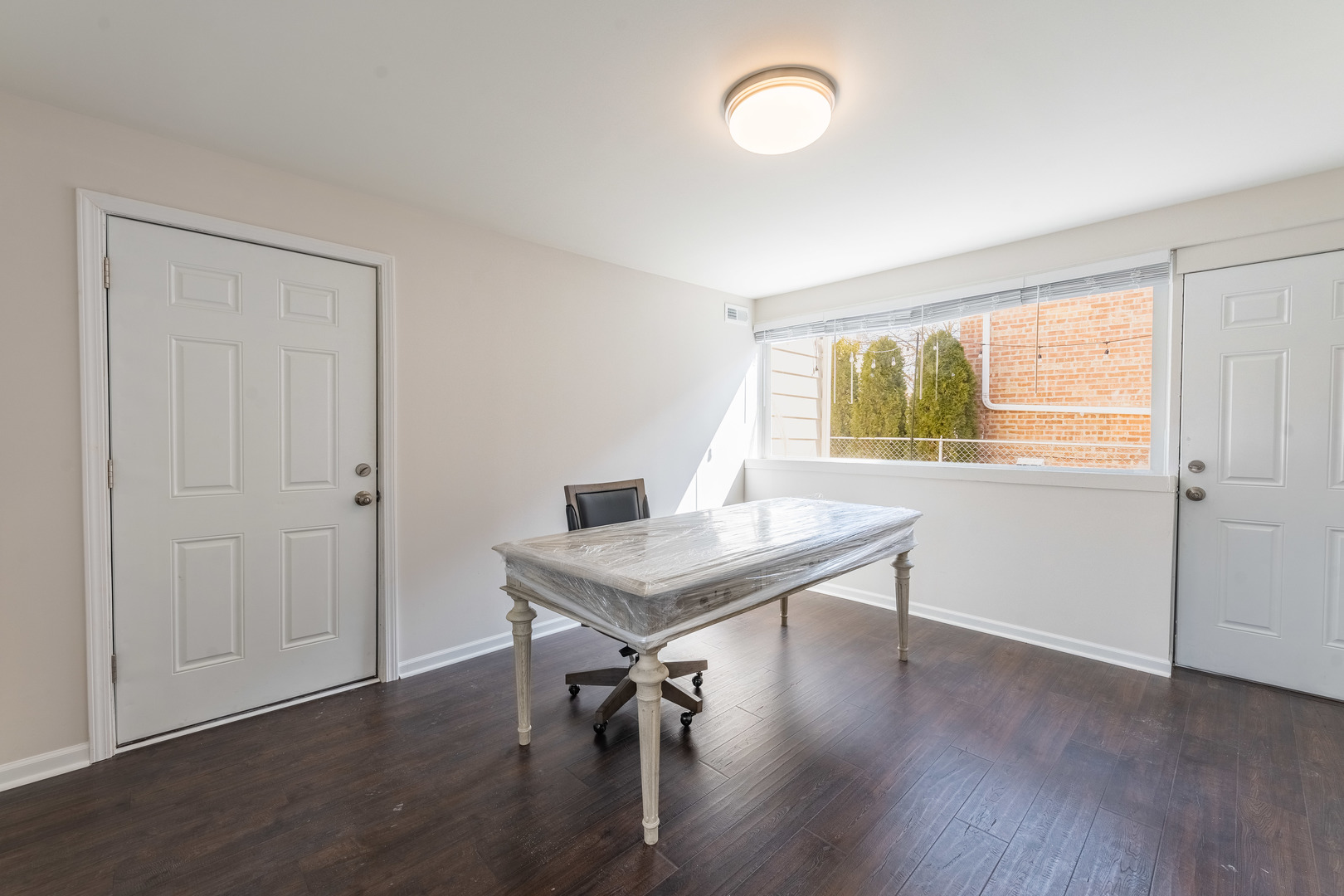 2335 14th Avenue North Riverside, IL 60546 - Photo 19 of 33 a view of a workspace with furniture and wooden floor
