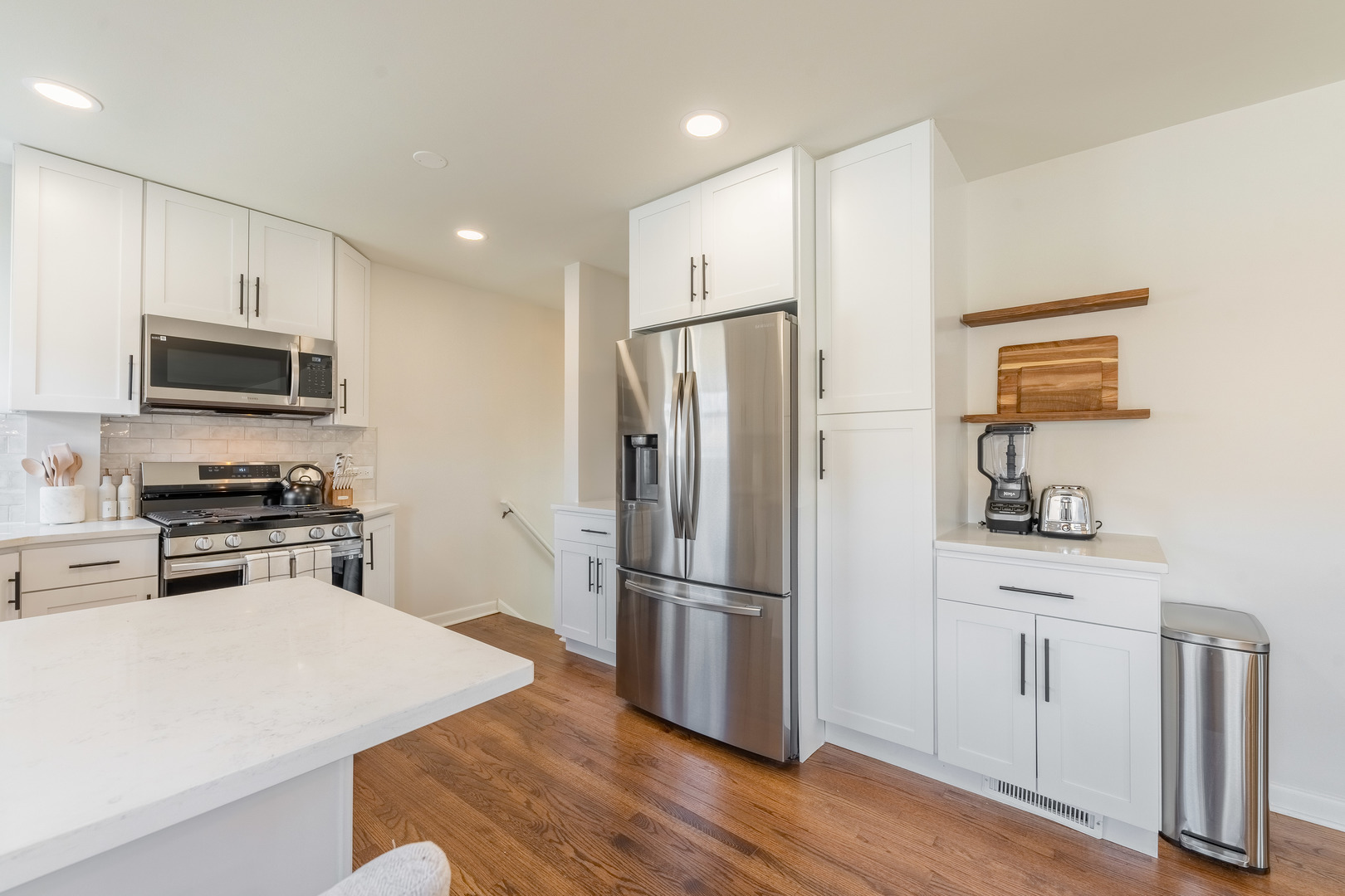 2335 14th Avenue North Riverside, IL 60546 - Photo 7 of 33 a kitchen with wooden cabinets and stainless steel appliances