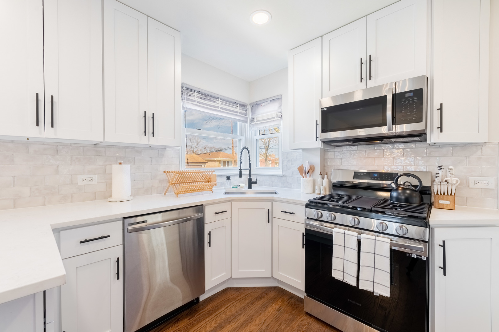 2335 14th Avenue North Riverside, IL 60546 - Photo 10 of 33 a kitchen with stainless steel appliances white cabinets and a stove top oven