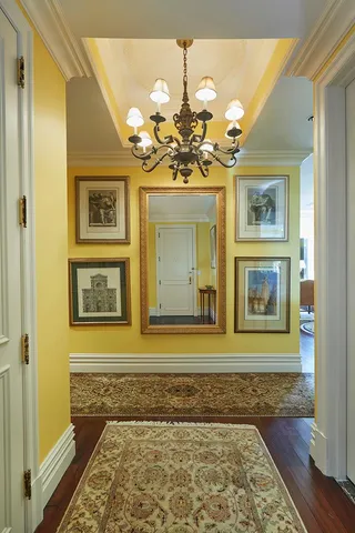 a hallway with a chandelier