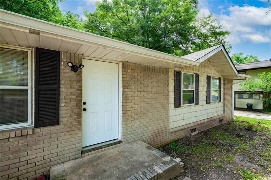 6516 Maddox Road Morrow, GA 30260 - Photo 1 of 1 a view of a small house with yard