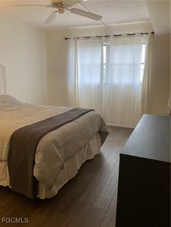 a spacious bedroom with a bed and a walk in closet