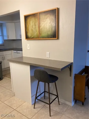 a room with a table and chairs