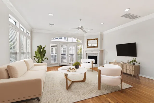 a living room with fireplace furniture and a flat screen tv