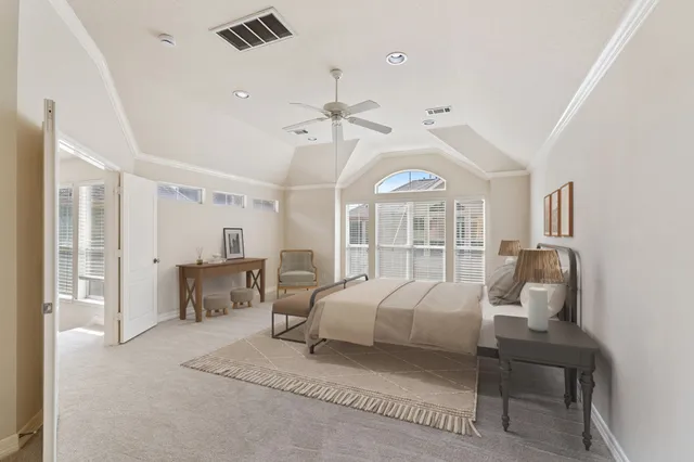 a bedroom with furniture and a chandelier