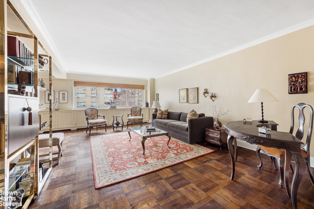 35 Park Avenue, Unit 12C Manhattan, NY 10016 - Photo 2 of 14 a living room with furniture and wooden floor
