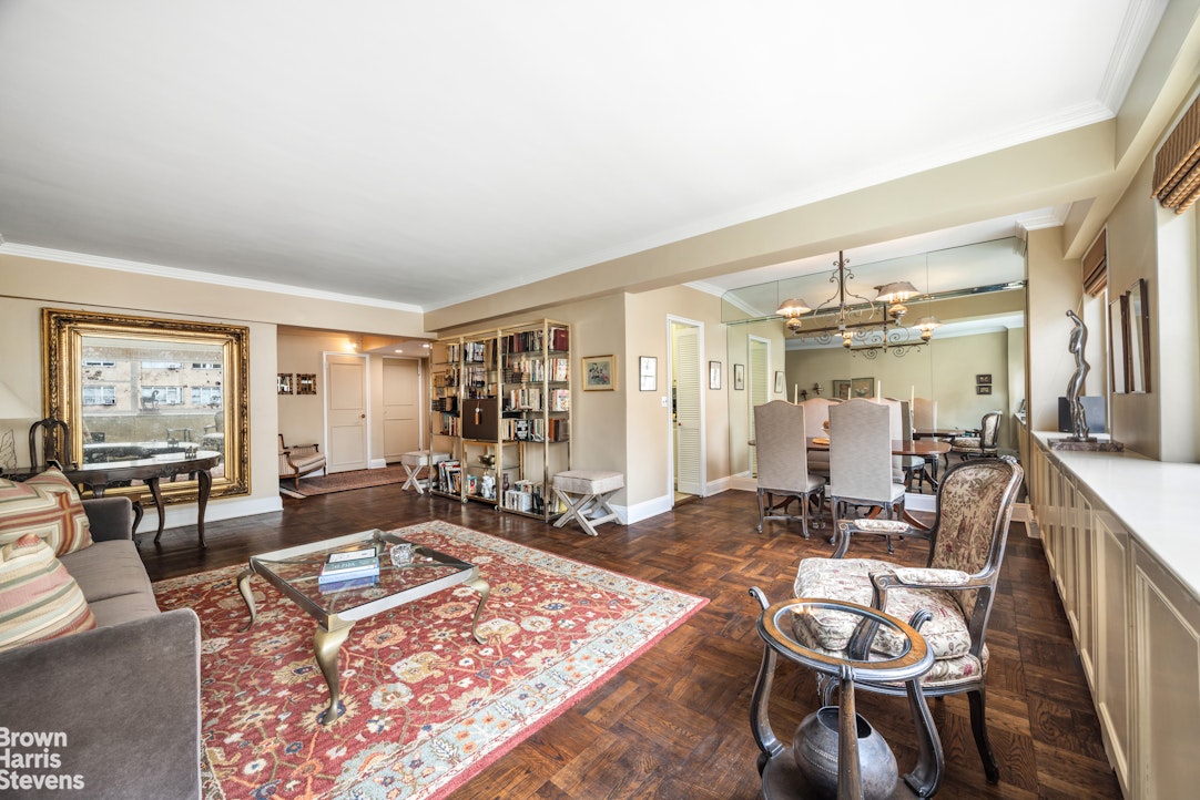 35 Park Avenue, Unit 12C Manhattan, NY 10016 - Photo 3 of 14 a living room with furniture and a table