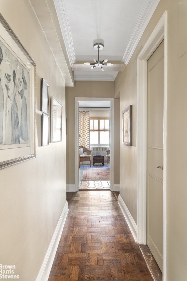 35 Park Avenue, Unit 12C Manhattan, NY 10016 - Photo 6 of 14 a view of a hallway with a chandelier