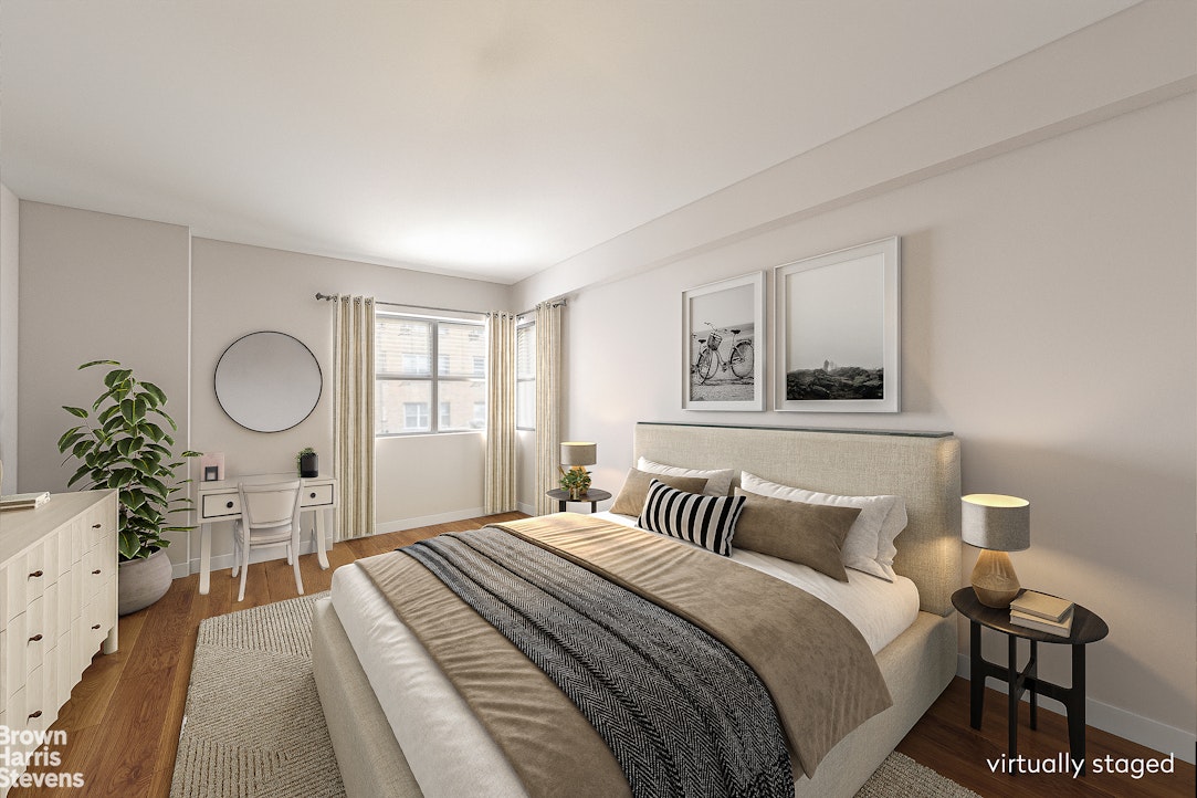 35 Park Avenue, Unit 12C Manhattan, NY 10016 - Photo 9 of 14 a bedroom with a bed and a potted plant