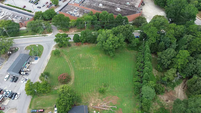 an aerial view of residential house with outdoor space and swimming pool