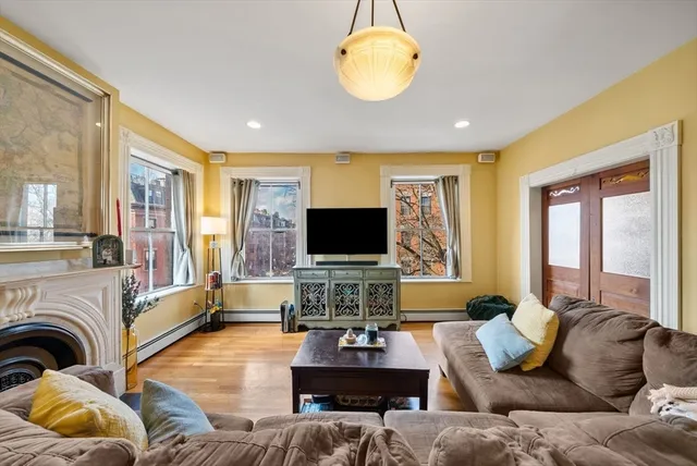 a living room with furniture or couch and a flat screen tv