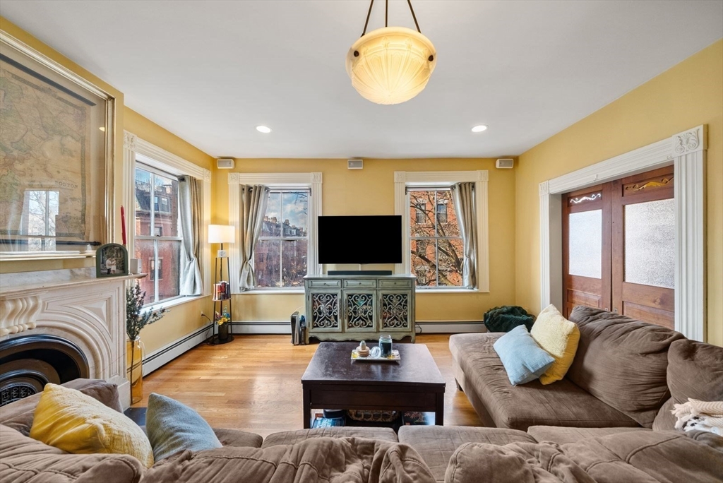 a living room with furniture or couch and a flat screen tv