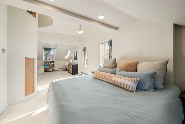 a living room with furniture and a lamp