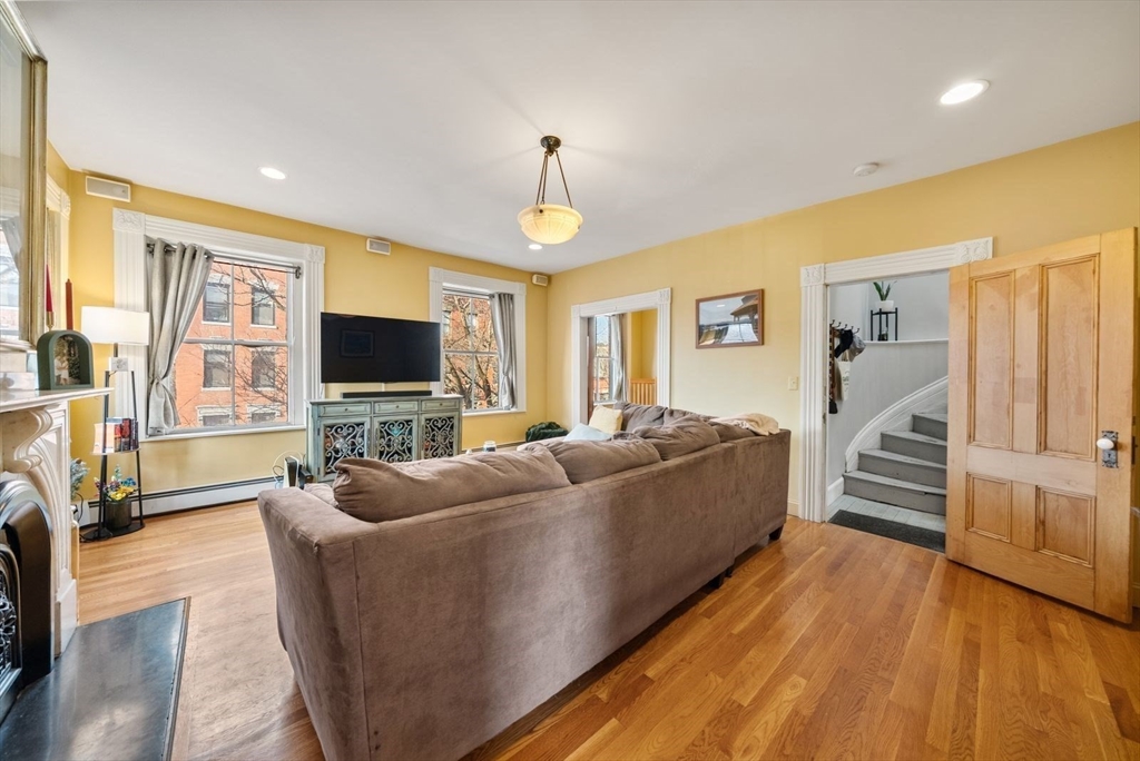 468 Shawmut Avenue, Unit 2 Boston, MA 02118 - Photo 2 of 30 a living room with furniture and a flat screen tv